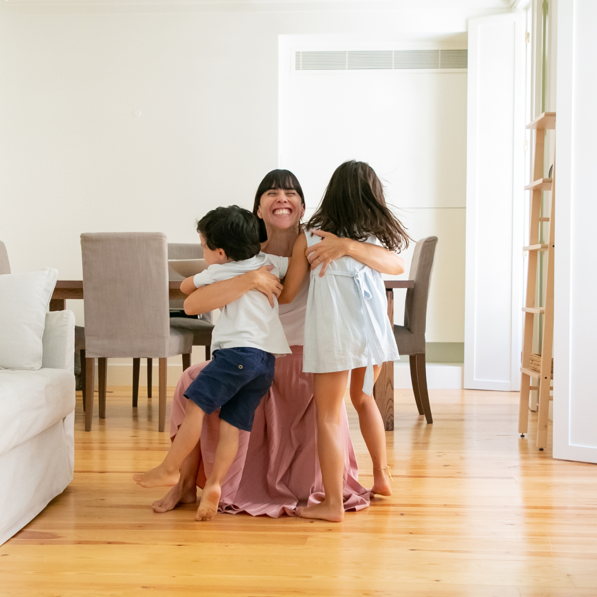 mom hugging her kids
